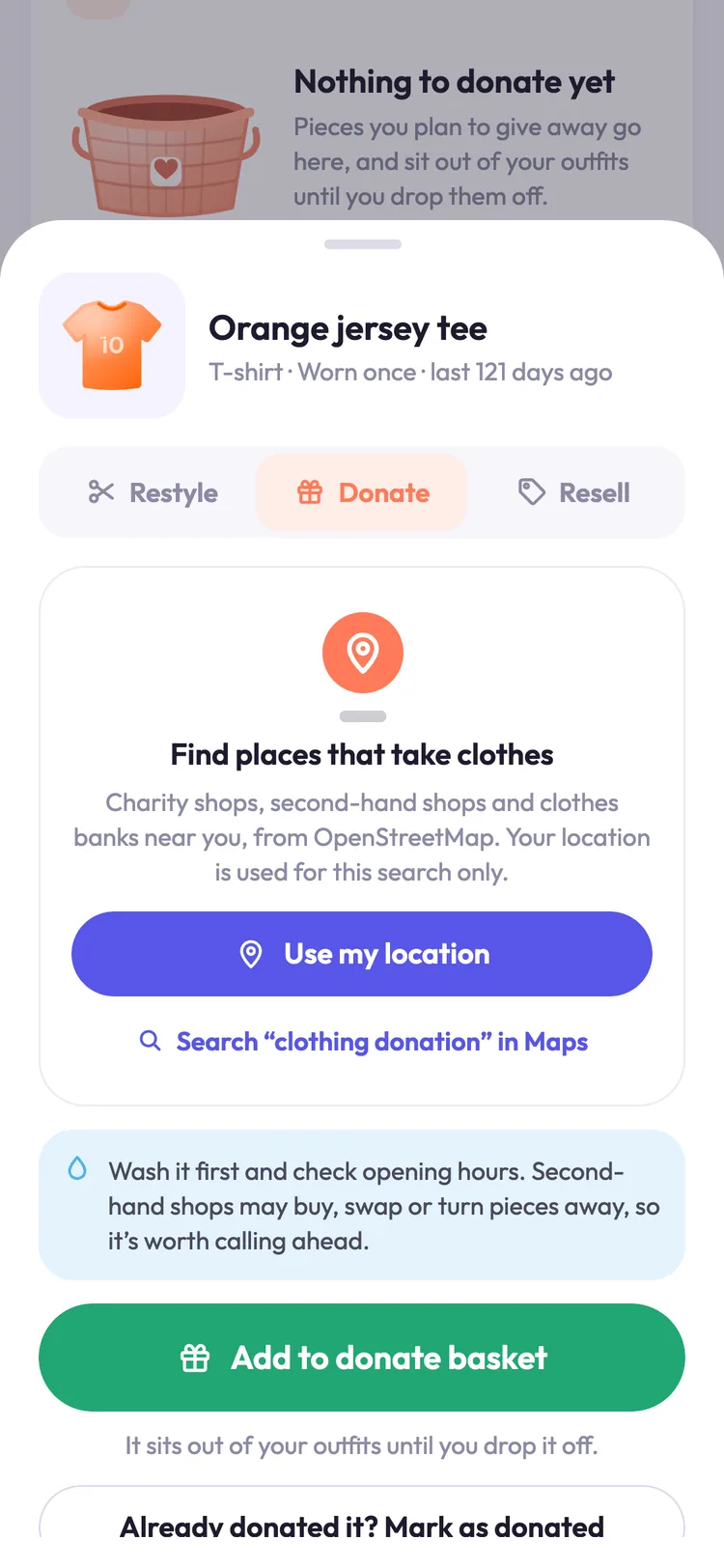 The Give it a second life sheet for an orange jersey tee, on its Donate tab: find places that take clothes nearby from OpenStreetMap, or add it to the donate basket.